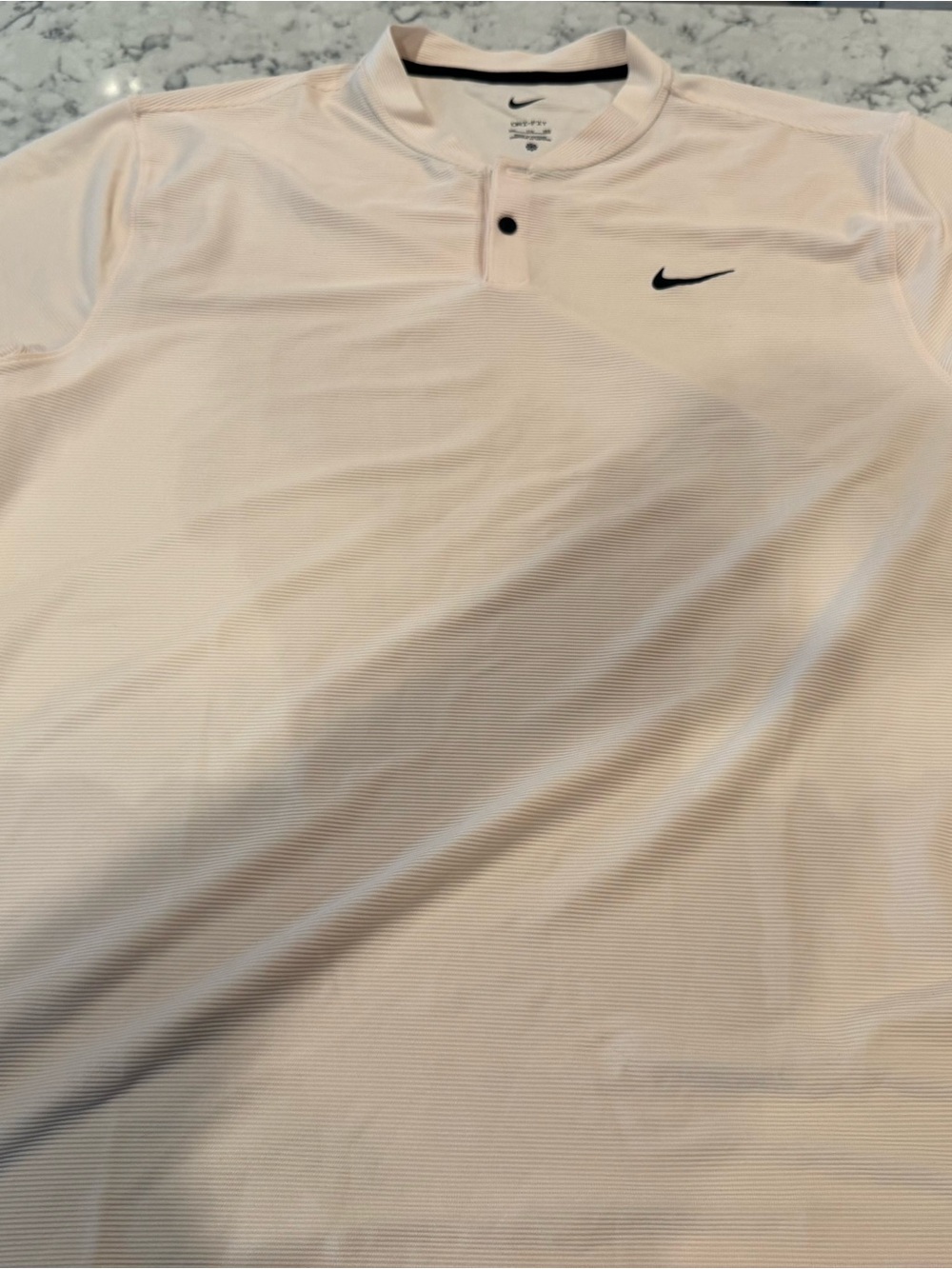 Nike Men’s Pale Pink Short-Sleeve Henley Polo with Black Swoosh